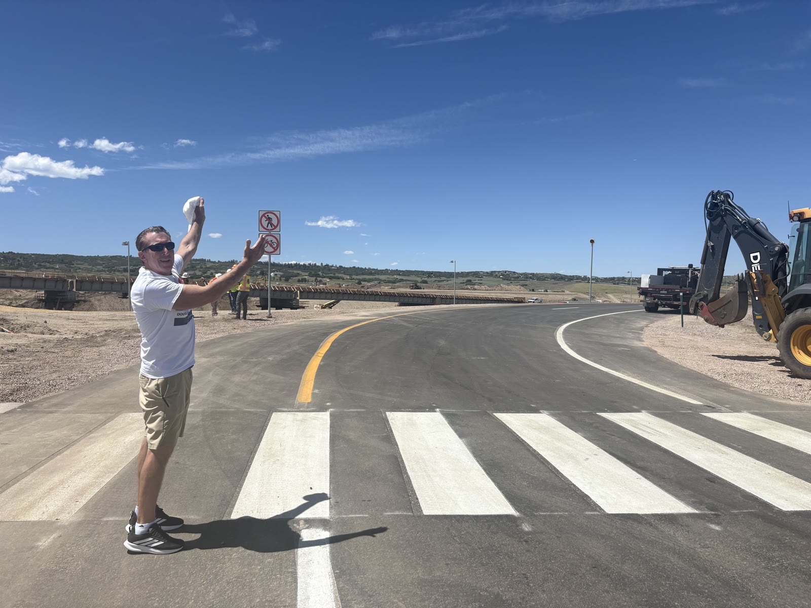 Celebrating on the newly opened Crystal Valley Interchange roadway at I-25 in Castle Rock on opening day